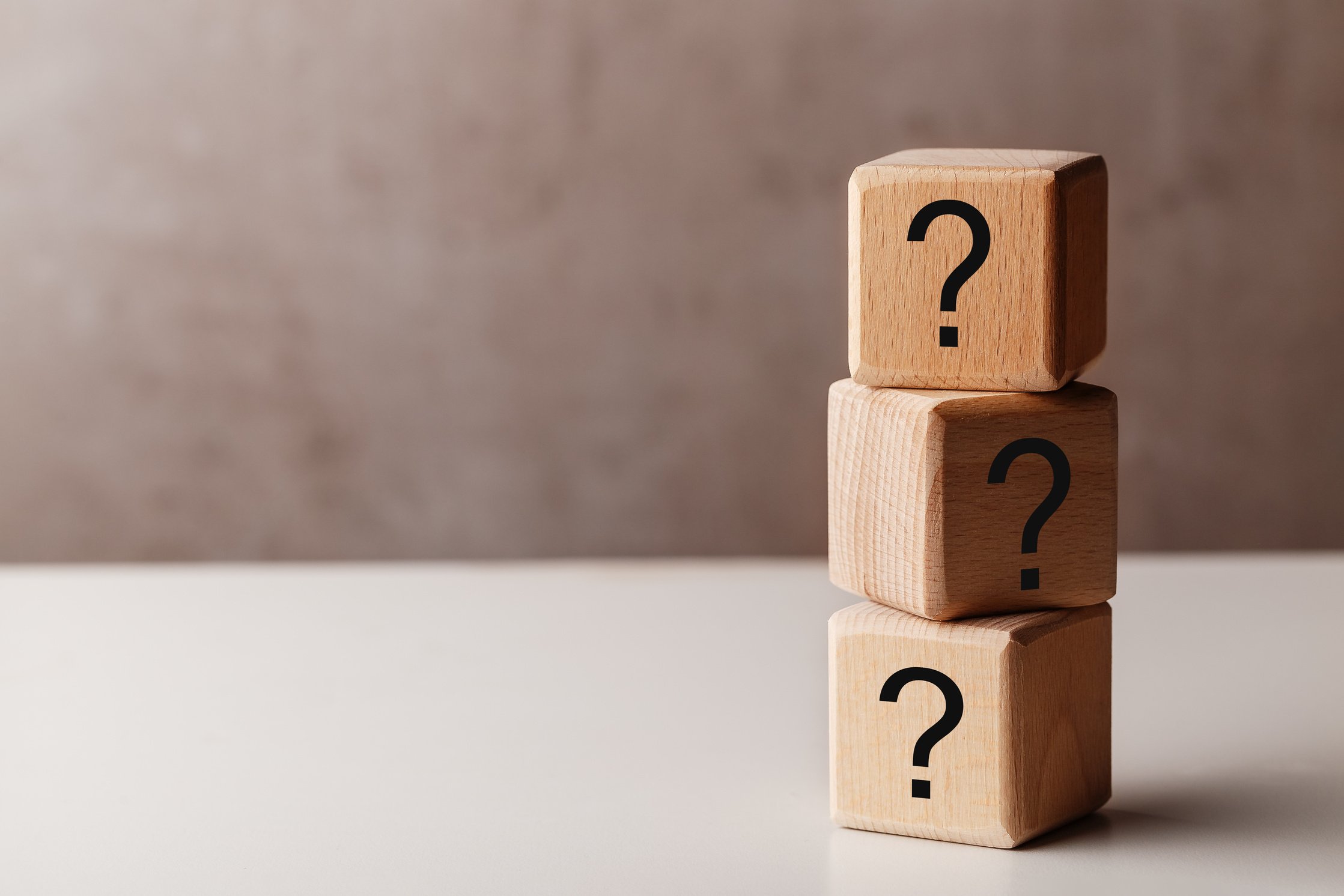 Pile of Wooden Cubes with Question Marks